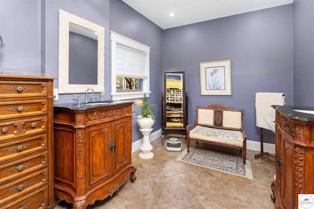 sitting room with light tile patterned flooring and baseboards