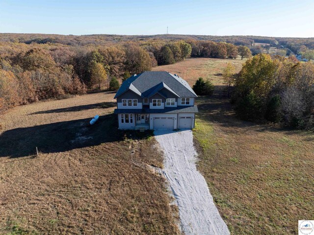 19166 Brockman Ave, Cole Camp, MO 65325 - bird's eye view featuring a wooded view