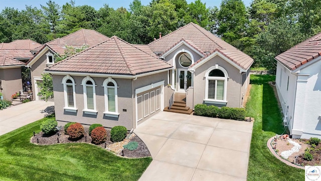 4517 NE Fairway Homes Dr, Lees Summit, MO 64064 - mediterranean / spanish-style home with driveway, a tiled roof, a garage, stucco siding, and a front yard