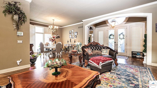 4517 NE Fairway Homes Dr, Lees Summit, MO 64064 - living room featuring a chandelier, wood finished floors, crown molding, a textured ceiling, and french doors