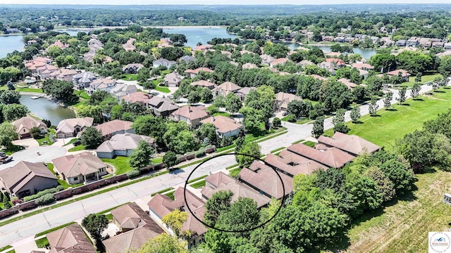 4517 NE Fairway Homes Dr, Lees Summit, MO 64064 - aerial view of residential area featuring a nearby body of water