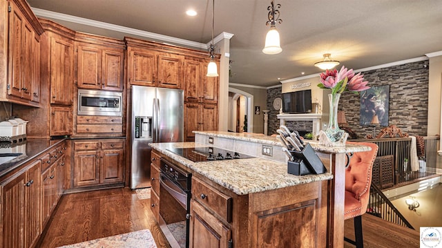 4517 NE Fairway Homes Dr, Lees Summit, MO 64064 - kitchen with black appliances, dark wood finished floors, brown cabinetry, a kitchen island, and ornamental molding