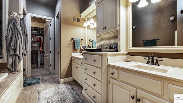4517 NE Fairway Homes Dr, Lees Summit, MO 64064 - bathroom featuring vanity and a walk in closet