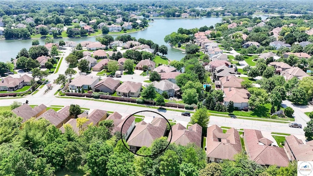 4517 NE Fairway Homes Dr, Lees Summit, MO 64064 - aerial perspective of suburban area featuring a nearby body of water