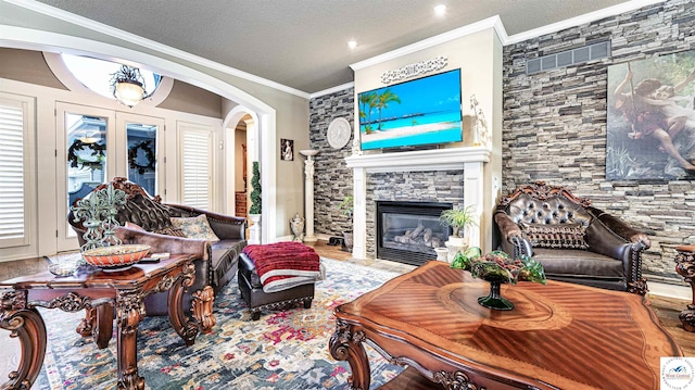 4517 NE Fairway Homes Dr, Lees Summit, MO 64064 - living area with crown molding, arched walkways, a fireplace, and a textured ceiling