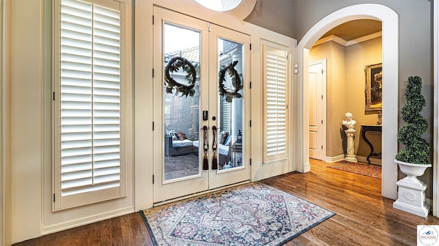 4517 NE Fairway Homes Dr, Lees Summit, MO 64064 - entryway featuring arched walkways, wood finished floors, and french doors