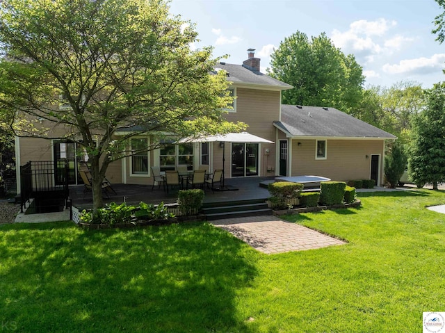 2105 Stonewood Cir, Sedalia, MO 65301 - back of house with a deck, a chimney, a lawn, and roof with shingles