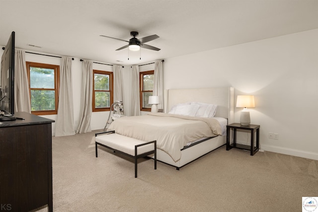 2105 Stonewood Cir, Sedalia, MO 65301 - bedroom with light carpet and a ceiling fan