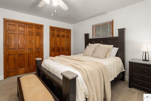 2105 Stonewood Cir, Sedalia, MO 65301 - carpeted bedroom with two closets and ceiling fan