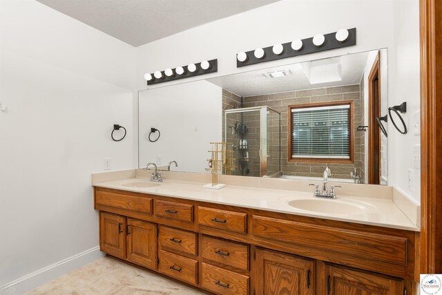 2105 Stonewood Cir, Sedalia, MO 65301 - full bath with a stall shower, double vanity, and tile patterned flooring