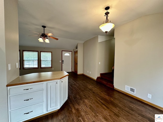 616 E Main St, Warsaw, MO 65355 - kitchen featuring lofted ceiling, dark wood-style floors, white cabinetry, ceiling fan, and hanging light fixtures