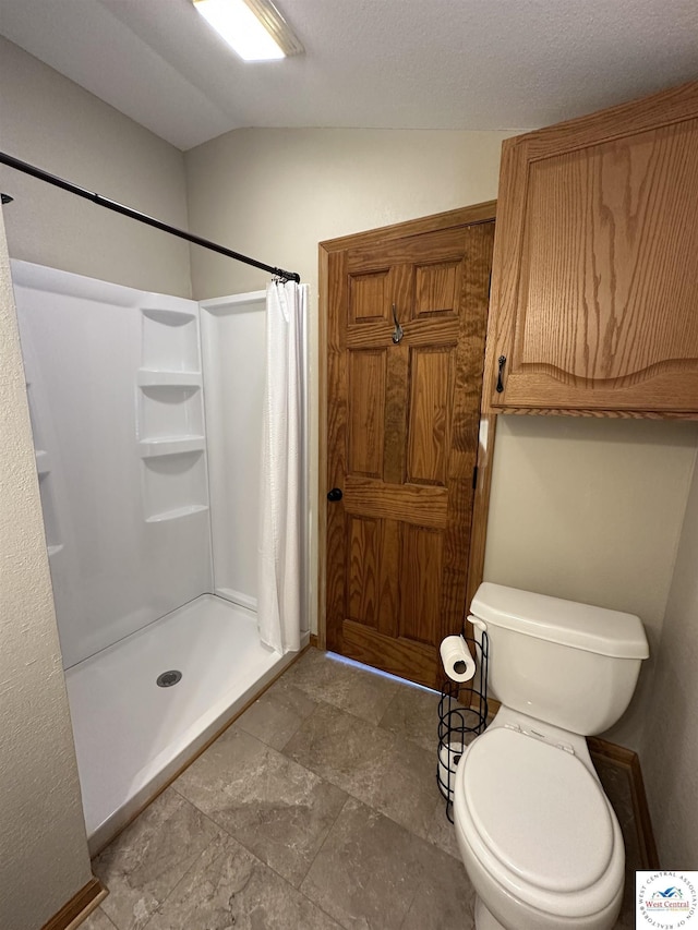 616 E Main St, Warsaw, MO 65355 - full bathroom with a stall shower and lofted ceiling