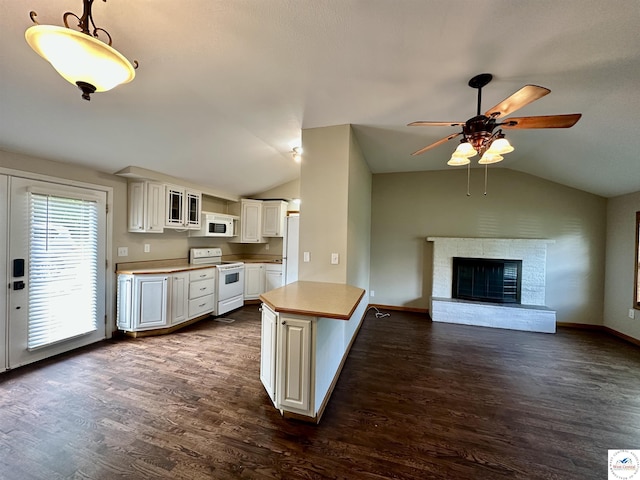 616 E Main St, Warsaw, MO 65355 - kitchen featuring white appliances, vaulted ceiling, dark wood-style flooring, ceiling fan, and white cabinets