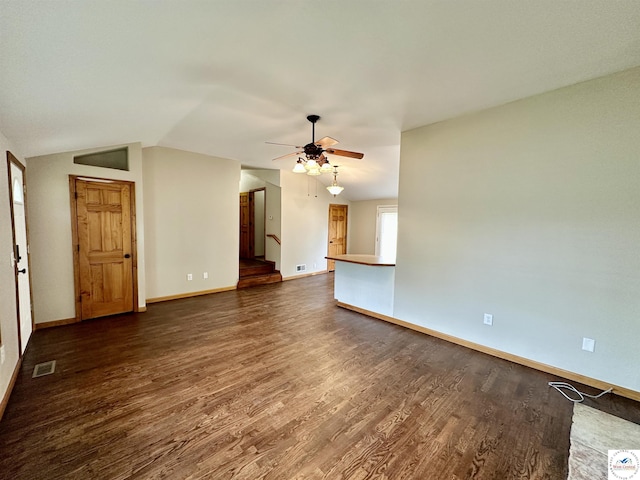 616 E Main St, Warsaw, MO 65355 - unfurnished living room with dark wood-style flooring, lofted ceiling, ceiling fan, and stairs