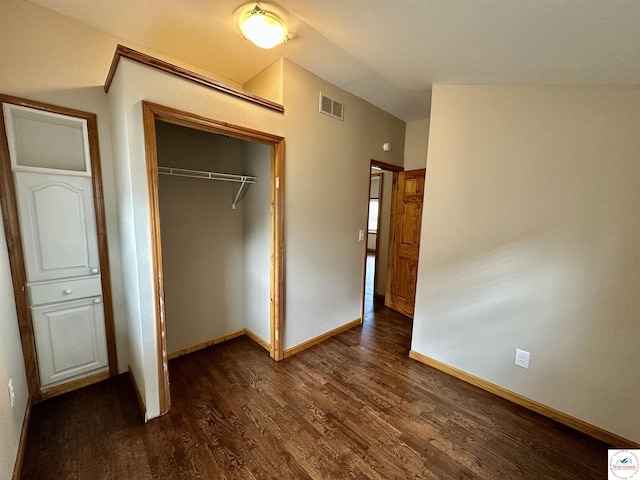 616 E Main St, Warsaw, MO 65355 - unfurnished bedroom with dark wood-type flooring and a closet
