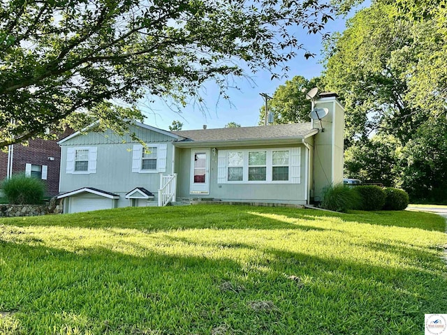 616 E Main St, Warsaw, MO 65355 - view of front of property with a chimney and a front yard