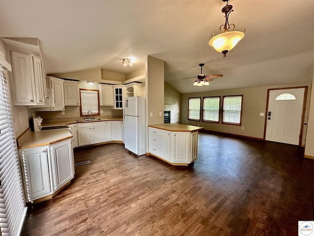 616 E Main St, Warsaw, MO 65355 - kitchen with freestanding refrigerator, vaulted ceiling, a ceiling fan, dark wood-style floors, and light countertops