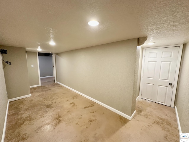 616 E Main St, Warsaw, MO 65355 - finished basement featuring a textured ceiling and baseboards