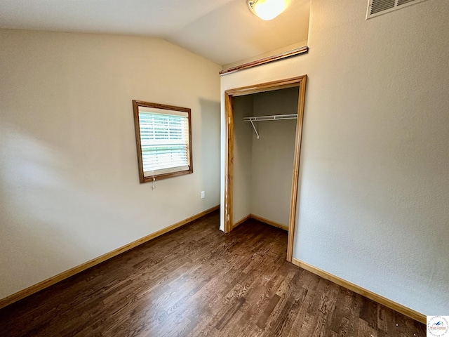 616 E Main St, Warsaw, MO 65355 - unfurnished bedroom featuring dark wood finished floors, a closet, and lofted ceiling