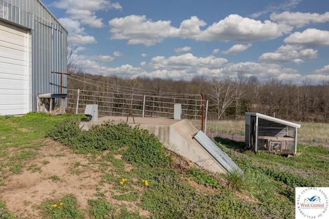24401 Black Hawk Trl, Cole Camp, MO 65325 - entry to storm shelter