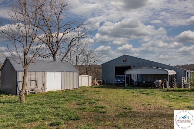 24401 Black Hawk Trl, Cole Camp, MO 65325 - view of green lawn featuring a garage
