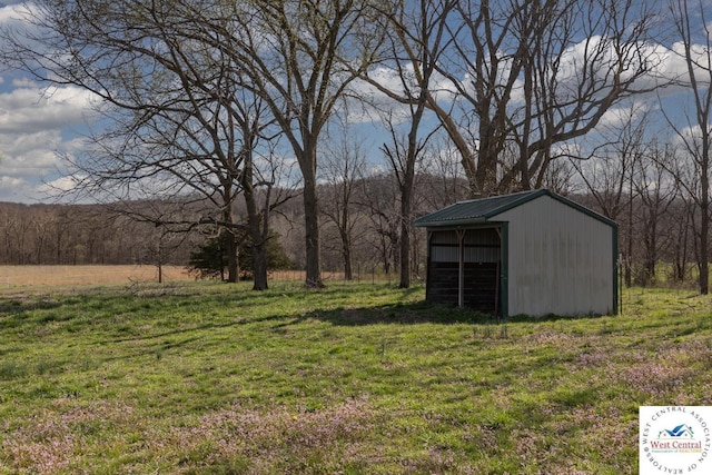 24401 Black Hawk Trl, Cole Camp, MO 65325 - view of green lawn with an outbuilding