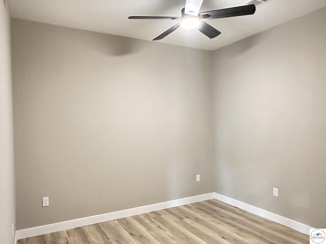 28927 Benton House Ave, Warsaw, MO 65355 - unfurnished room with baseboards, light wood-type flooring, and ceiling fan