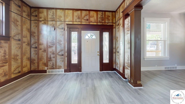 401 N Prospect St, Sedalia, MO 65301 - entrance foyer featuring baseboards, wood finished floors, and decorative columns
