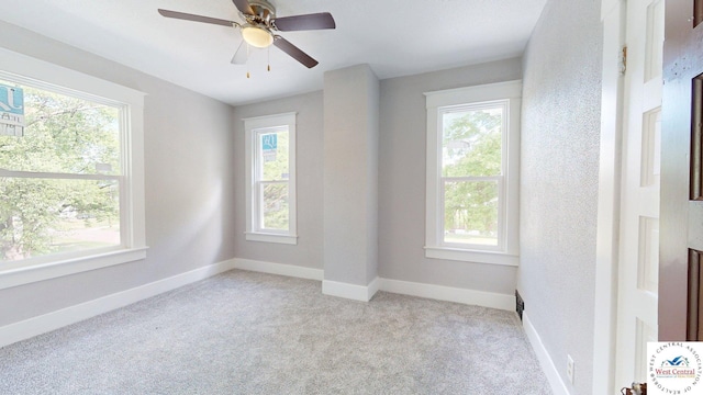 401 N Prospect St, Sedalia, MO 65301 - spare room with plenty of natural light, light carpet, baseboards, and a ceiling fan