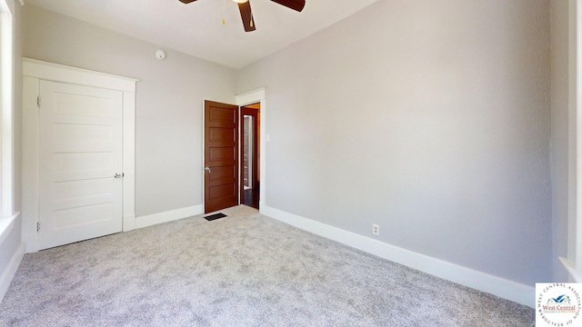 401 N Prospect St, Sedalia, MO 65301 - unfurnished bedroom with carpet floors, baseboards, and a ceiling fan