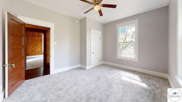 401 N Prospect St, Sedalia, MO 65301 - unfurnished bedroom featuring carpet floors, baseboards, and a ceiling fan