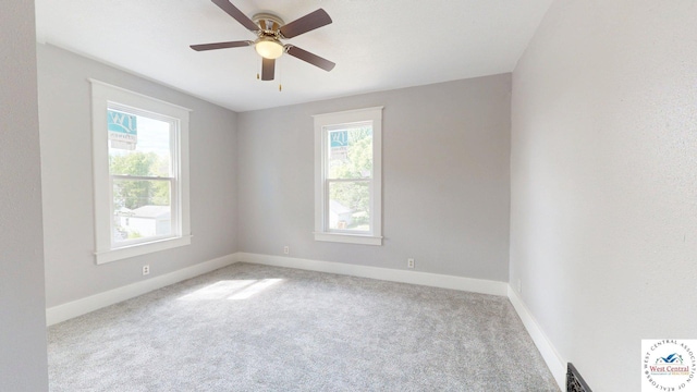 401 N Prospect St, Sedalia, MO 65301 - empty room with healthy amount of natural light, carpet floors, baseboards, and ceiling fan