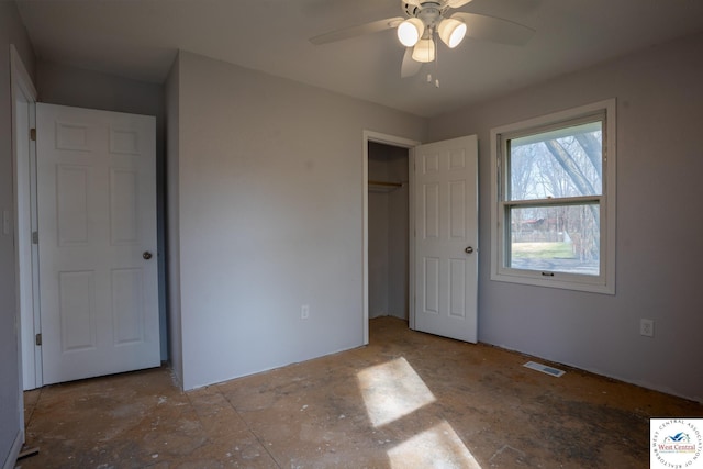 unfurnished bedroom featuring visible vents, a ceiling fan, and a closet