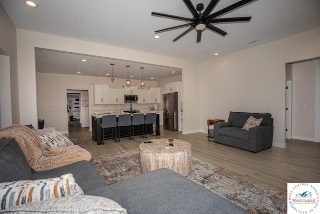26112 Georgetown Ave, Warsaw, MO 65355 - living area featuring recessed lighting, ceiling fan, baseboards, and light wood-type flooring