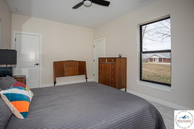 26112 Georgetown Ave, Warsaw, MO 65355 - carpeted bedroom featuring a ceiling fan, visible vents, and baseboards