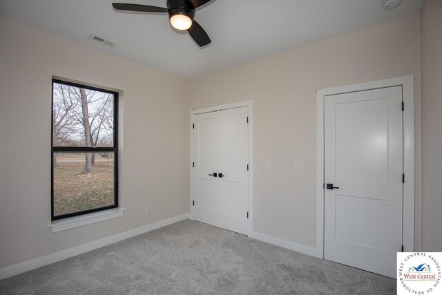 26112 Georgetown Ave, Warsaw, MO 65355 - unfurnished bedroom featuring a closet, ceiling fan, visible vents, baseboards, and carpet floors