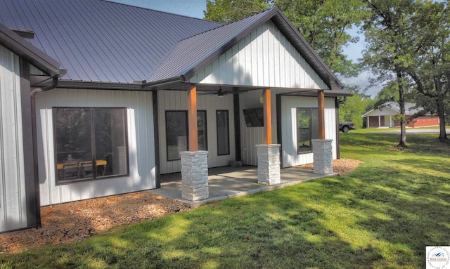 26112 Georgetown Ave, Warsaw, MO 65355 - rear view of property with metal roof, a yard, ceiling fan, and a patio area