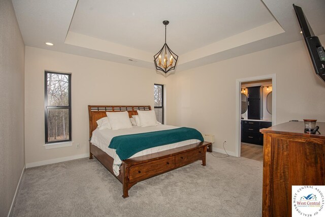 26112 Georgetown Ave, Warsaw, MO 65355 - bedroom with multiple windows, a raised ceiling, a chandelier, and baseboards