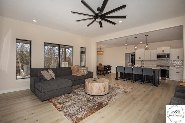 26112 Georgetown Ave, Warsaw, MO 65355 - living area with light wood-type flooring, ceiling fan, and recessed lighting