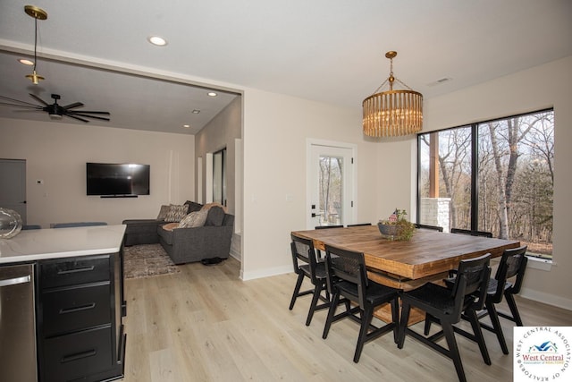 26112 Georgetown Ave, Warsaw, MO 65355 - dining room with recessed lighting, light wood-type flooring, visible vents, baseboards, and ceiling fan with notable chandelier