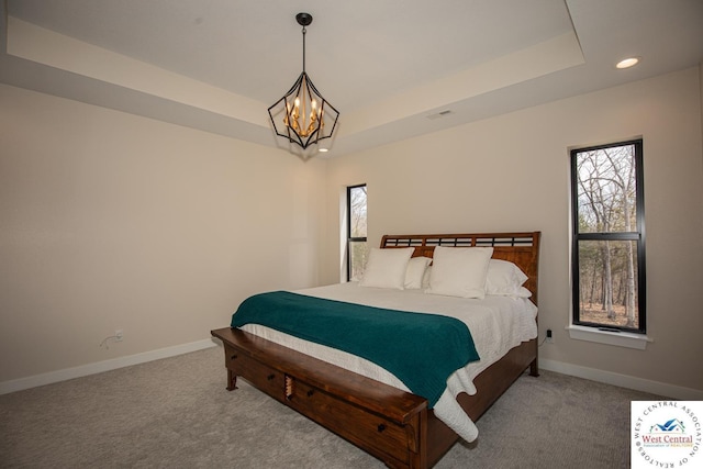 26112 Georgetown Ave, Warsaw, MO 65355 - bedroom featuring recessed lighting, carpet flooring, an inviting chandelier, a raised ceiling, and baseboards