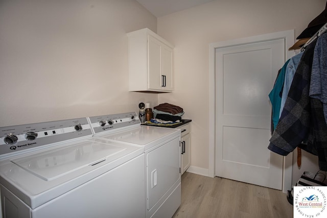 26112 Georgetown Ave, Warsaw, MO 65355 - clothes washing area with cabinet space, independent washer and dryer, and light wood-type flooring