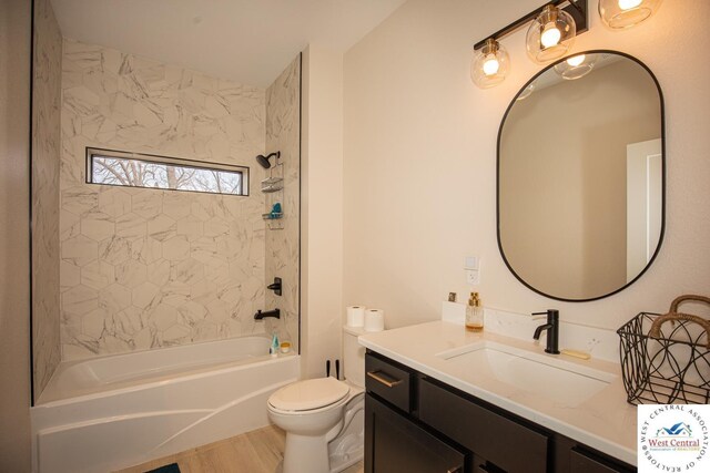 26112 Georgetown Ave, Warsaw, MO 65355 - bathroom with wood finished floors, vanity, toilet, and bathing tub / shower combination