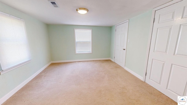 400 E 12th St, Sedalia, MO 65301 - unfurnished bedroom with light carpet and baseboards