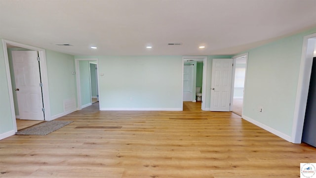 400 E 12th St, Sedalia, MO 65301 - spare room featuring baseboards, recessed lighting, and light wood-style floors