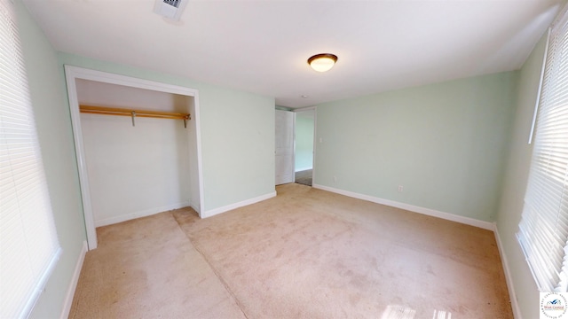 400 E 12th St, Sedalia, MO 65301 - unfurnished bedroom featuring carpet flooring, a closet, and baseboards