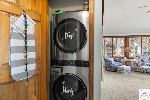 1436 Cherokee Rd, Lake Ozark, MO 65049 - laundry area featuring a ceiling fan, carpet flooring, and stacked washer and clothes dryer