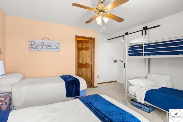 1436 Cherokee Rd, Lake Ozark, MO 65049 - bedroom featuring baseboards, a barn door, ceiling fan, and carpet floors