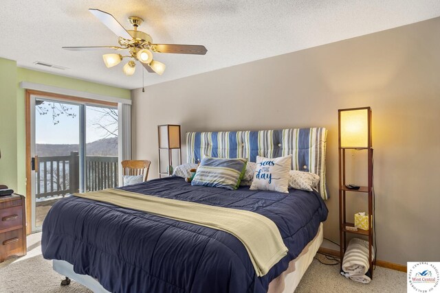 1436 Cherokee Rd, Lake Ozark, MO 65049 - bedroom featuring light colored carpet, access to outside, ceiling fan, visible vents, and a textured ceiling