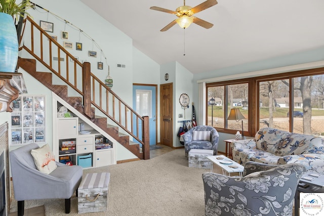 1436 Cherokee Rd, Lake Ozark, MO 65049 - living room featuring carpet flooring, ceiling fan, high vaulted ceiling, stairs, and visible vents